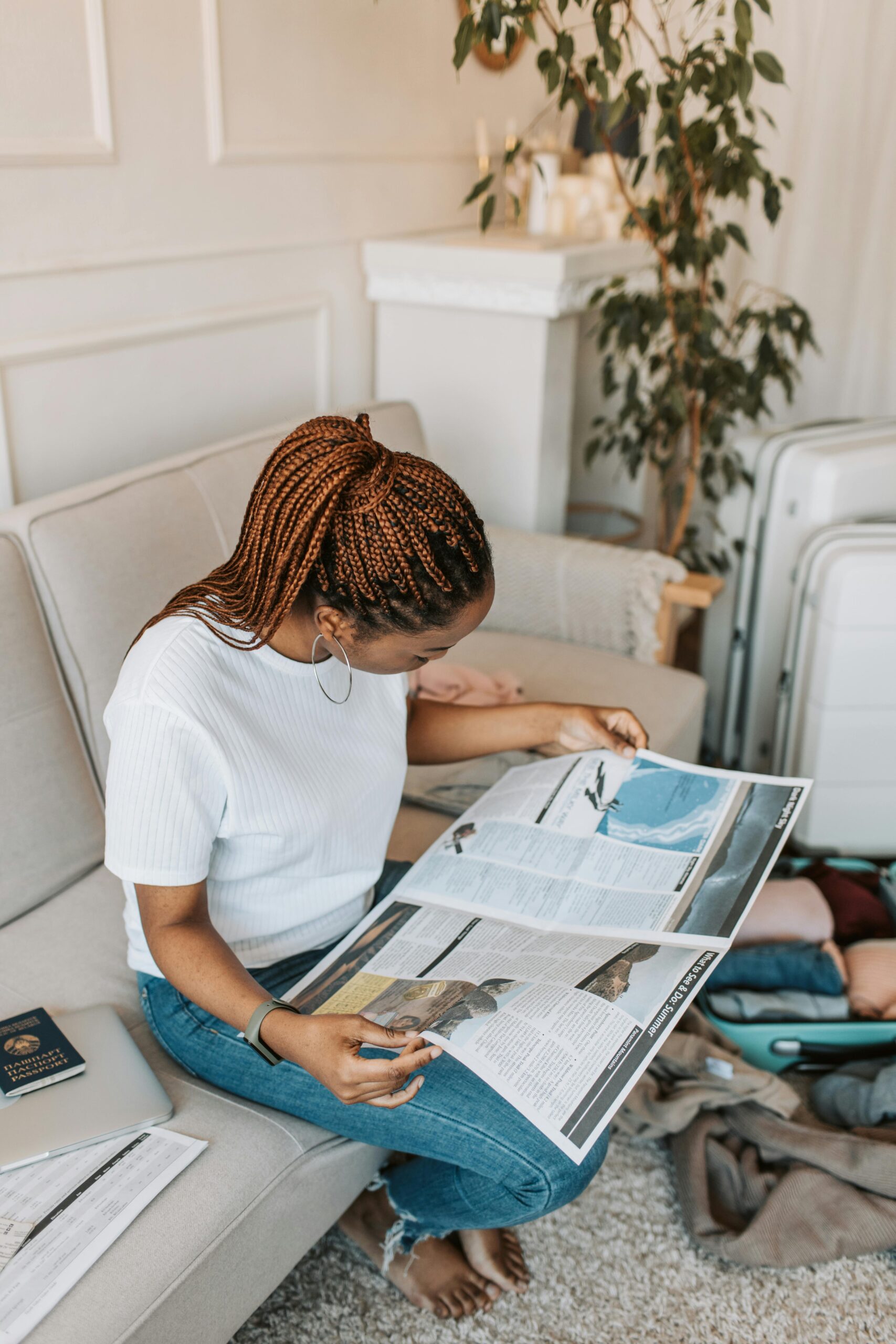 woman reading and pitching print travel magazines