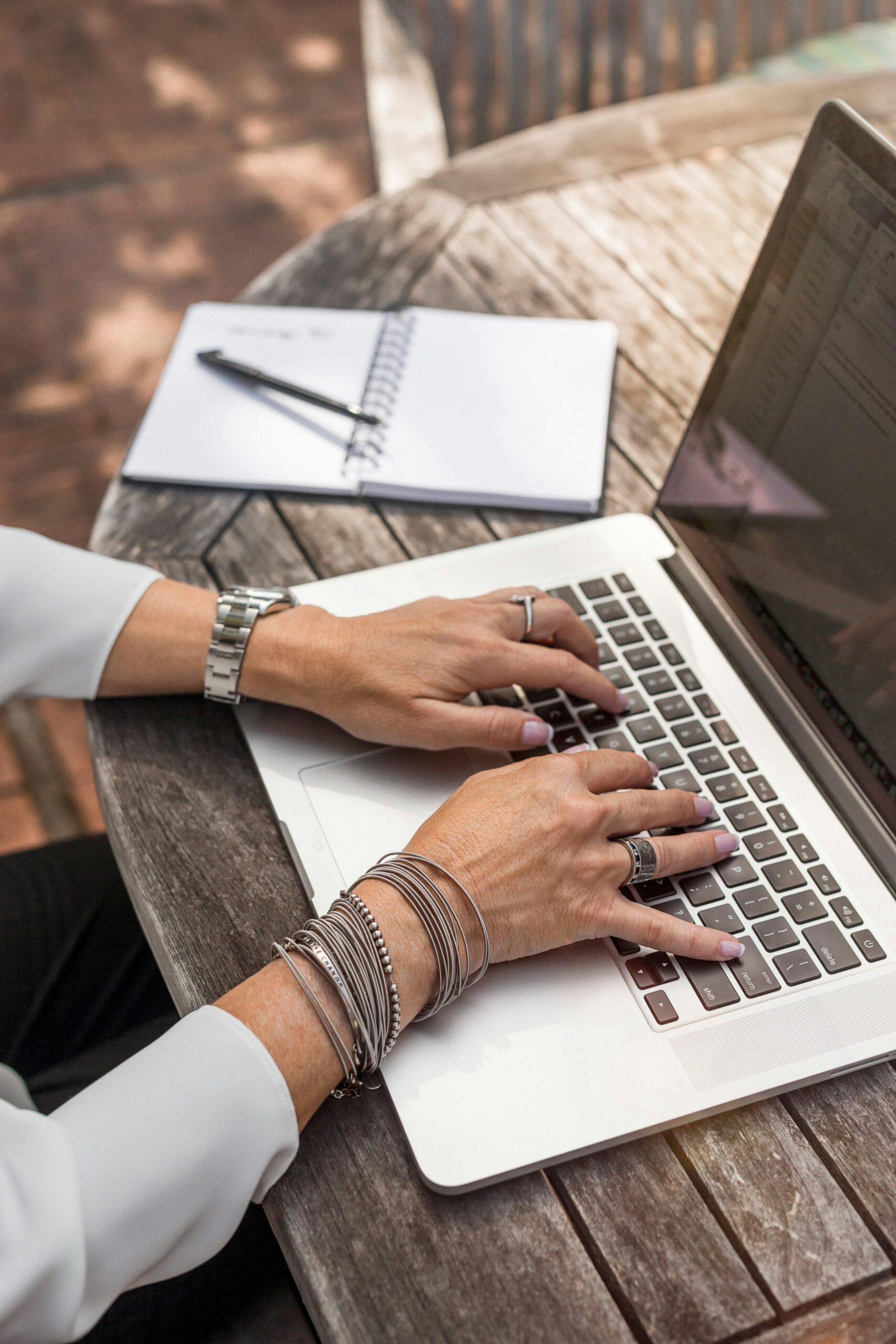 editor typing on a laptop