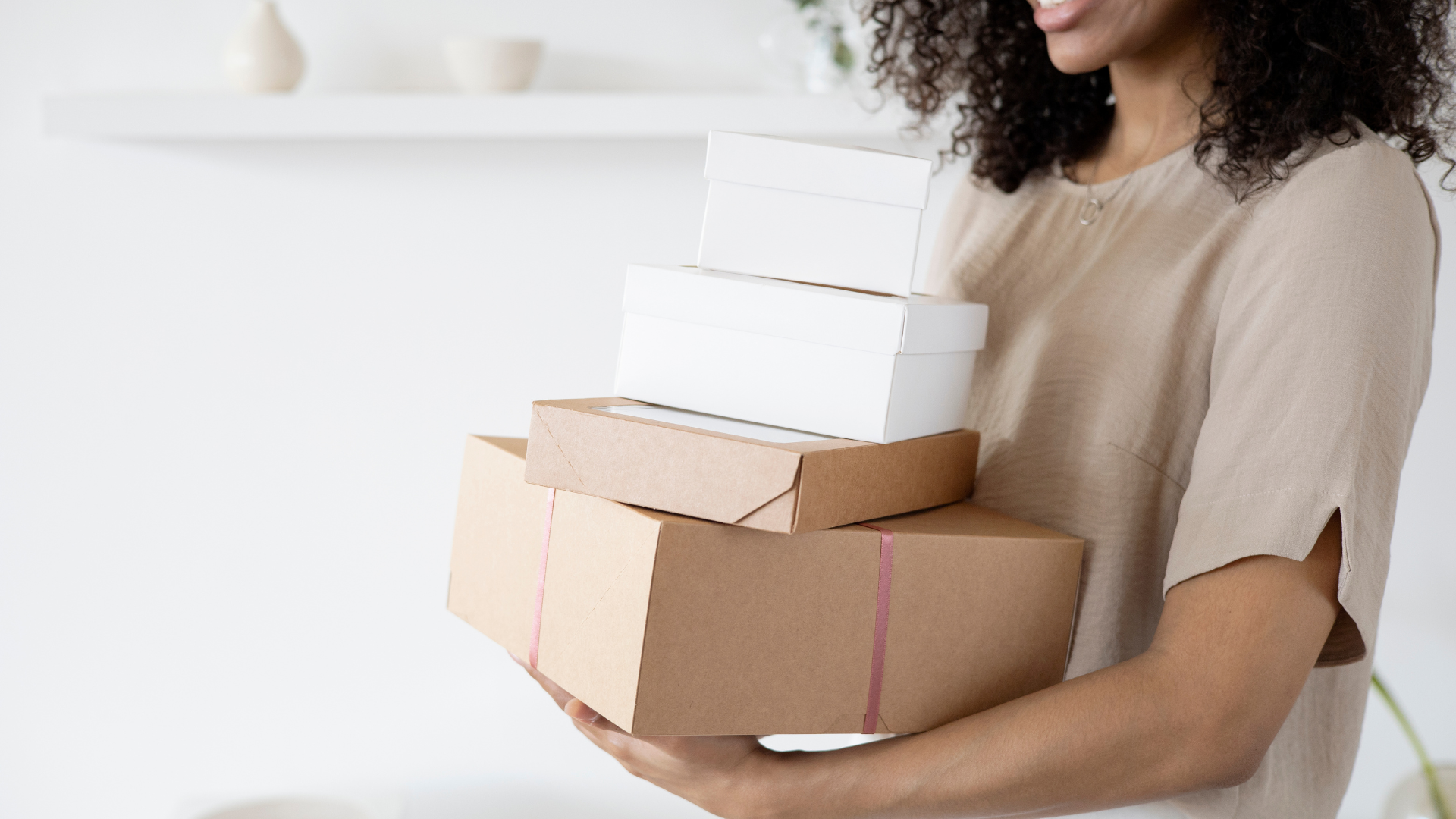 woman holding gift boxes